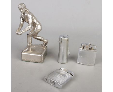 Four vintage lighters, comprising three Ronson lighters and a Japanese white metal player statue lighter (W8 x H15cm).