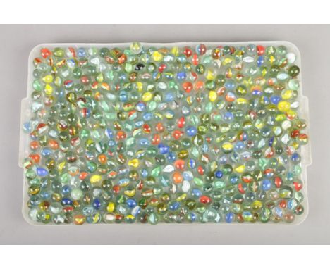 A tray containing a large quantity of vintage glass marbles.