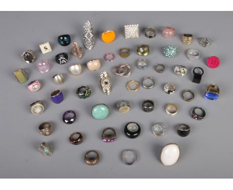 A good collection of over fifty assorted dress rings with examples including, glass, liquid filled, stacking, Lord of the Rin