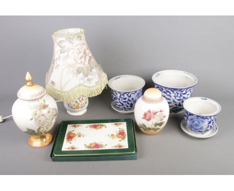 A collection of mostly assorted ceramics to include Aynsley 'Cottage Garden' table lamp, three blue and white planters and tw