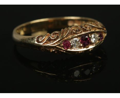 An 18ct Gold Ruby and Diamond five stone ring, within boat shaped setting. Size N½. Total weight: 3.1g.