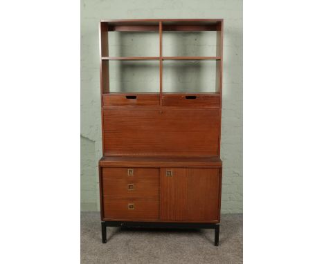 A Wrightons teak three sectional unit with drawers, drinks cabinet and shelving Hx187cmWx99cmDx44cm  has some scratches and o