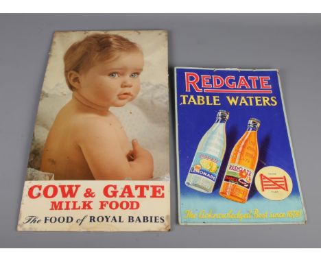 A vintage metal Cow &amp; Gate Milk Food display sign featuring the slogan "The Food of Royal Babies," accompanied by a Redga
