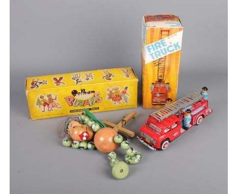 Two boxed vintage children's toys to include Baby Dragon Pelham puppet and Japanese tin plate Friction Fire Truck with workin