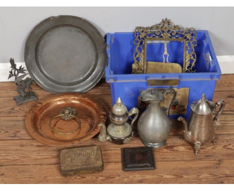 A box of metalware, including large copper and pewter chargers, silver-plated jugs and flatware, a large brass frame, tin box