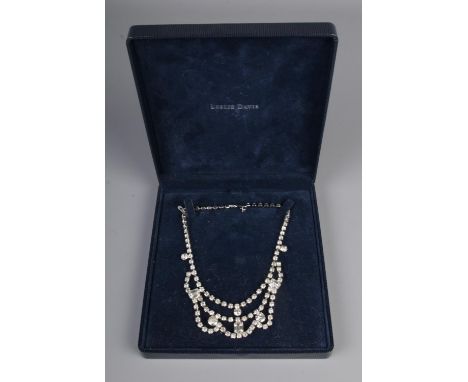 A vintage cased rhinestone necklace.
