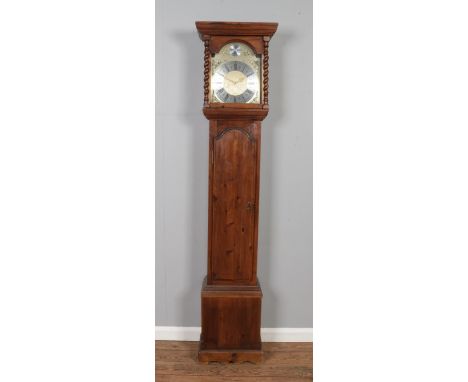 A vintage reproduction longcase clock with quartz movement behind the dial and Korean mechanical movement with pendulum insid