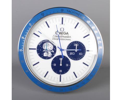 A Omega "Speedmaster" watch style wall clock, blue surround with white dial.  Quartz movement, working, diameter 40cm.