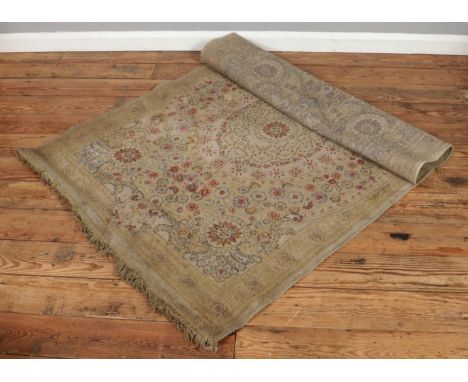 A vintage floor rug with a central medallion floral design. Size: W114 x D175cm.