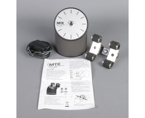 A MTE watch winder, with two watch holders, comes with charger and manual.  Working condition, missing battery cover.