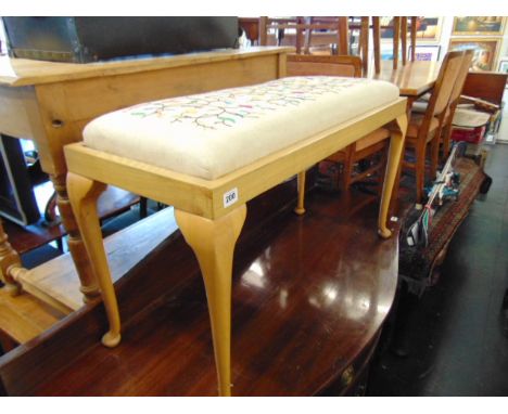 A tapestry upholstered double stool