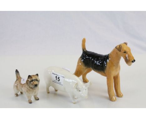 Three Beswick ceramic animals to include; Champion Wall Queen 40 Pig, Champion Cast Iron monarch Fox Terrier & a Cairn Terrie