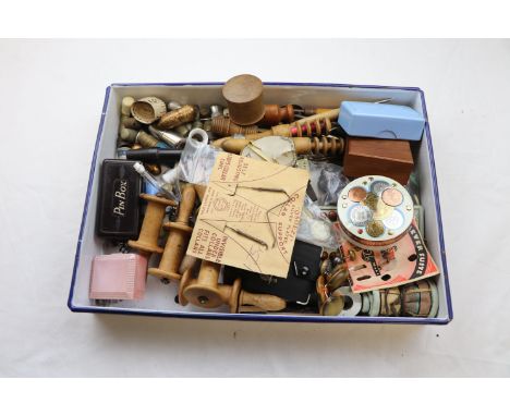 Vintage sewing tools to include wooden bobbins, needle cases, thimble cases and thimbles including advertising thimbles, pin 