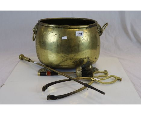 Brass coal bucket with paw feet and Lion mask handles plus three vintage Fire tools