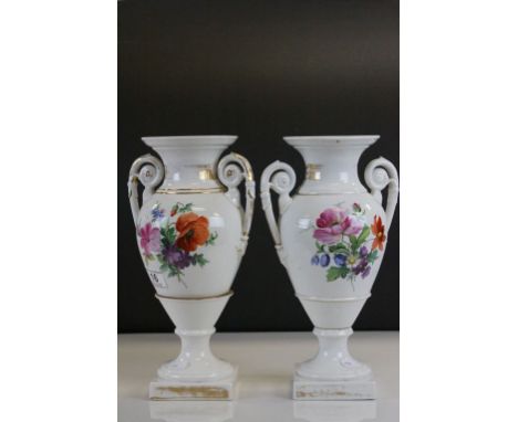 Pair of twin handled ceramic Vases with hand painted floral design and crossed sword Meissen type marks to the base