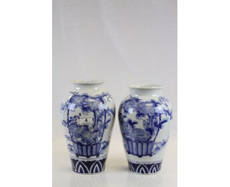 Two Oriental 19th century Blue and White Ceramic vases with Chrysanthemum Design