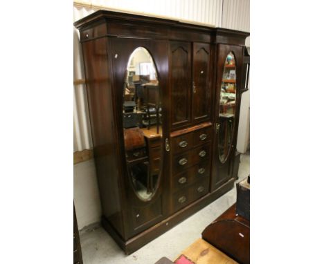 Edwardian Mahogany Inlaid Triple Compendium Wardrobe comprising central cupboard over a bank of two short and three long draw