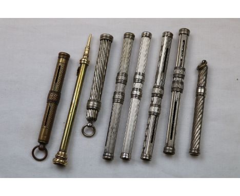 Propelling pencils to include white metal and plated, a gold plated propelling pencil with amethyst intaglio inset to termina