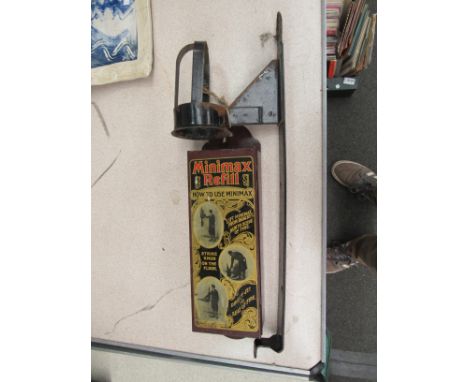A 1920's Minimax wall mounted fire extinguisher refill box with advertising design to panel, together with extinguisher mount