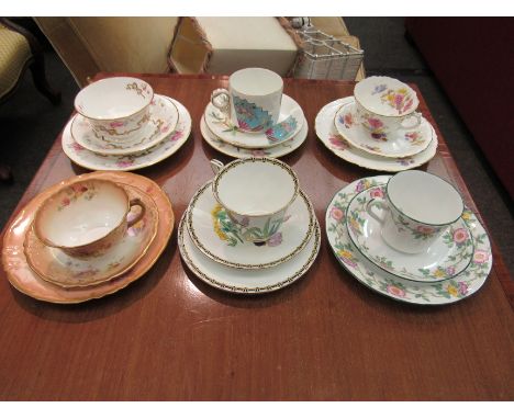 Five trios of cups, saucers and side plates, mainly floral highlighted in gilt, Adderley and other makers. Six trios of cups,