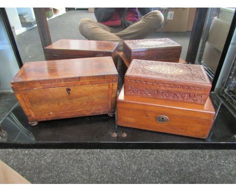 An Eastern hardwood carved box, an Edwardian mahogany tea caddy on bun feet and another box (3)