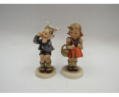 A pair of Hummel, Germany, figures of boy and girl, girl restored 
