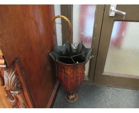 An umbrella form stick stand