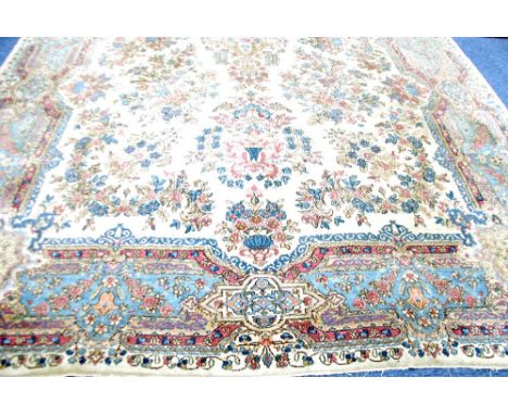 LARGE KIRMAN PERSIAN CARPET, with central floral medallion with pendants and an all over design of large floral sprays on an 