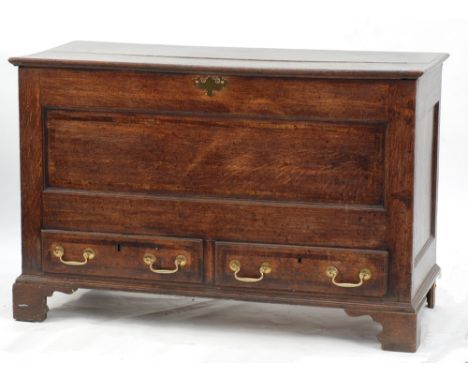LATE 18th CENTURY OAK AND MAHOGANY CROSSBANDED DOWER CHEST, the moulded oblong two plank top above a panelled front with pair
