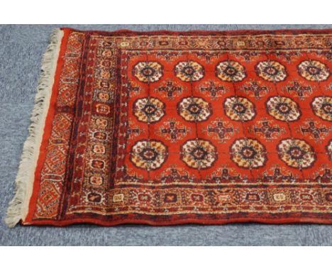 MACHINE MADE 'BOKHARA' RUG, with three rows of guls on a crimson field, 6'3" x 4'5" and an EASTERN RUG OF 'CHINESE' STYLE, wi
