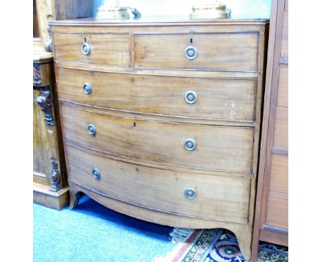 EARLY 19TH CENTURY MAHOGANY BOW FRONTED CHEST OF DRAWERS, the shaped top with later side pieces above two short and three lon