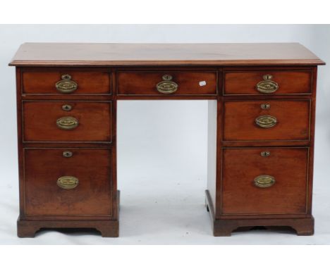 NINETEENTH CENTURY MAHOGANY KNEEHOLE DESK, the moulded oblong top above seven cockbeaded drawers around the kneehole, fitted 