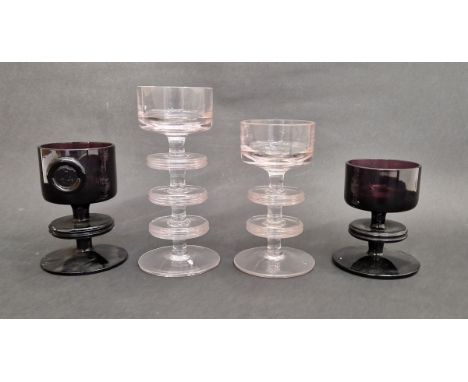 Four Wedgwood "Sheringham" glass candlesticks&nbsp;designed by Ronald Stennett-Wilson, to include a clear three ring candlest