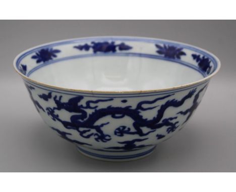 A blue and white dragon, crane and Phoenix bowl, Jiajing mark and period. Painted to the exterior with a five claw dragon, a 