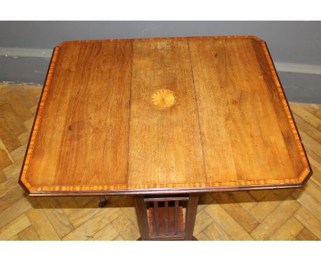 An Edwardian mahogany, satinwood crossbanded and ebony strung Sutherland table, patera inlaid top with double gate, on splaye