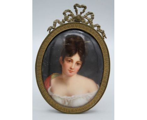 A 19th century German porcelain plaque, painted in polychrome enamels with a bust length portrait of a young lady, probably H