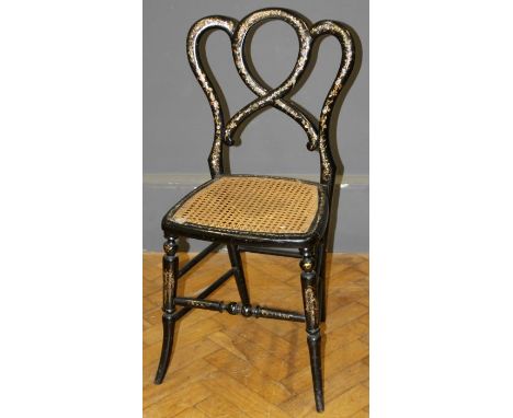 A Victorian black lacquer, mother of pearl inlaid and gilded single chair, with crown back and cane seat, on splayed forelegs