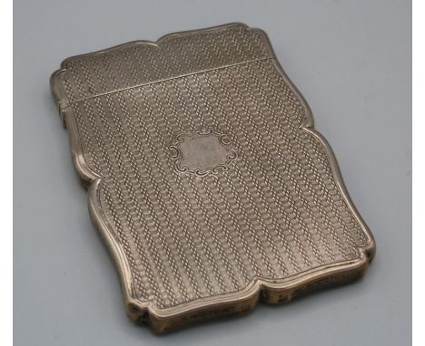 Nathaniel Mills, an early Victorian silver card case, shaped outline with engine turned decoration and vacant shield cartouch