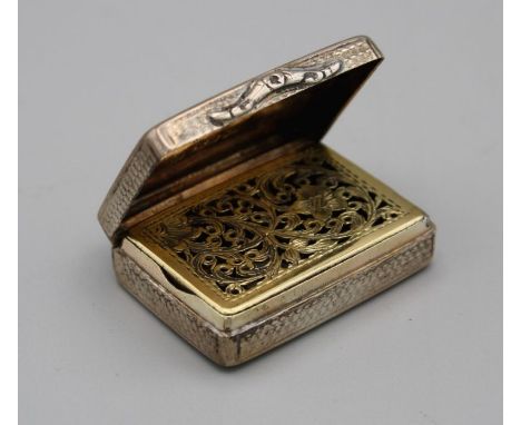 Nathaniel Mills, a William IV silver vinaigrette, oblong with engine turned decoration around a vacant cartouche, florally pi