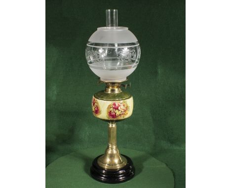 A Victorian oil lamp with porcelain bowl and glass shade