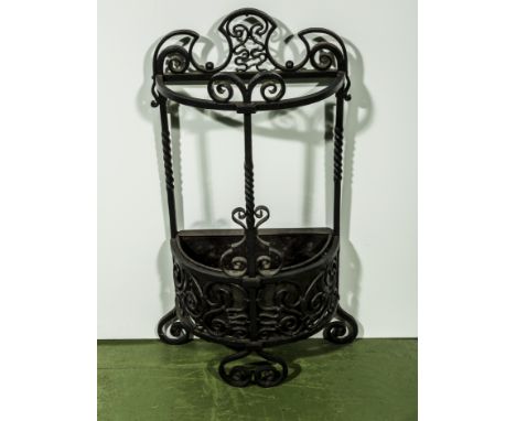 A wrought iron stick stand.