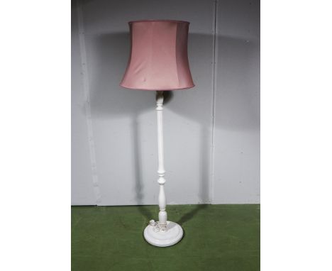 A painted standard lamp and shade
