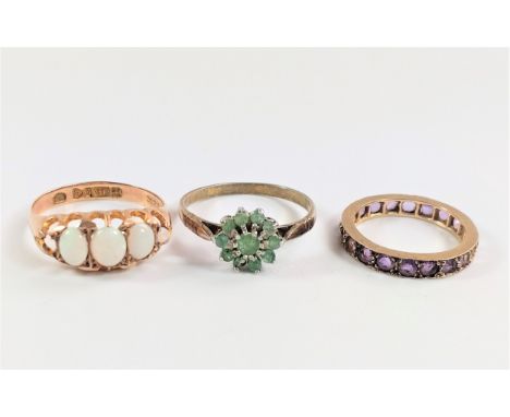 Three dress rings; opal, emerald, and eternity 5.50g size L. Circa 1900/1920. 