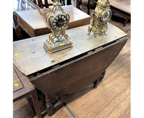 A George III Oak Gate Leg Table. In need of restoration. 