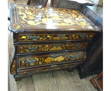 A19th century Dutch Bombe Marquetry Commode. Fitted with three long graduated drawers. Inlaid with flowers and foliage. On br