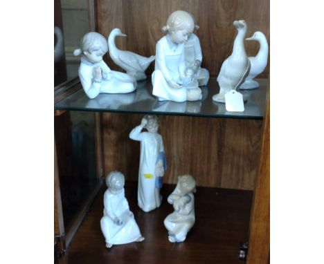 Nao figures of children 11cm to 27cm high and three geese (9) 
