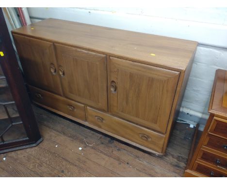 An Ercol sideboard.  Circa 1970. 76cm x 125cm x 43cm. 