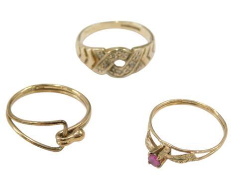 A 9ct gold and diamond ring, size M, 9ct gold and ruby solitaire ring, size K, and a 9ct gold clip ring, size M, 4.2g.