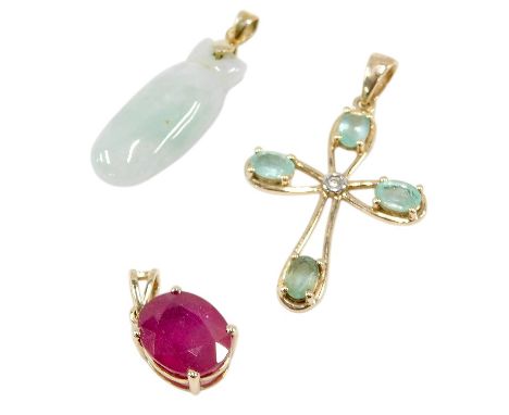 A 9ct gold and gem set pendant cross, in an open work design, 9ct gold and ruby solitaire pendant, oval cut in a claw setting