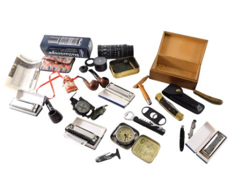 A collection of items, to include three Blues Band Hohner harmonicas, compasses, pipes, calendar, hunting knife, etc. 
